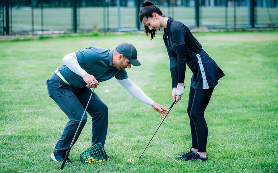 golf lessons - coach with student